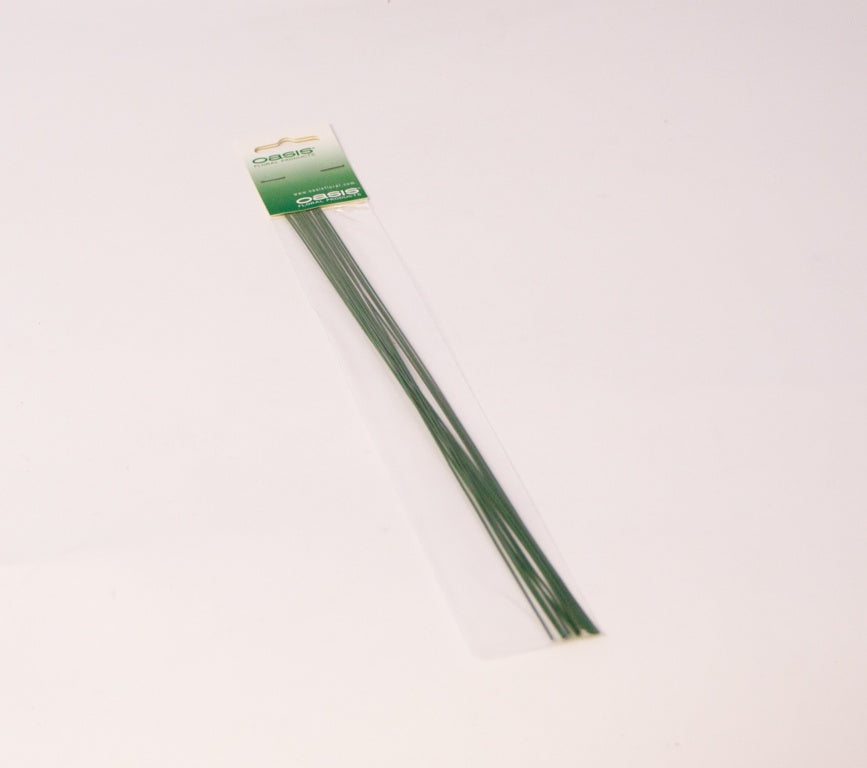 Green metal rods with a packaging label on a white background