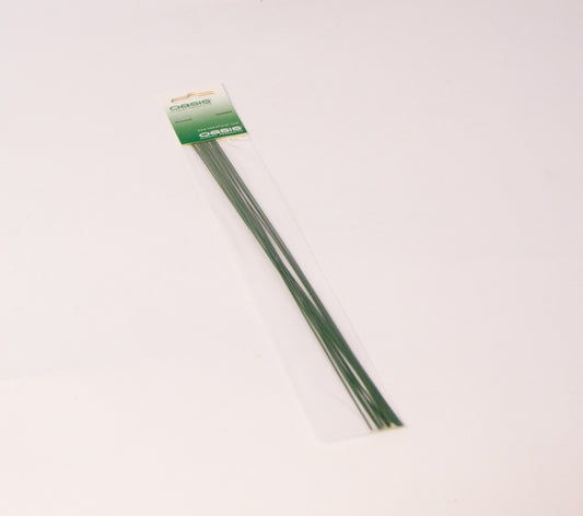 Green metal rods with a packaging label on a white background