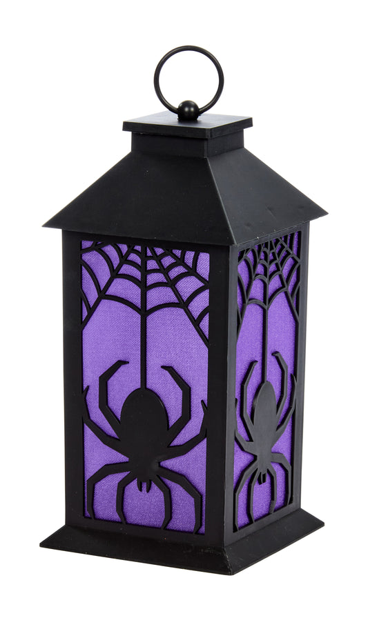 Halloween-themed lantern with spider design on a white background