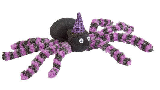 Purple and black spider toy with a witch hat on a white background