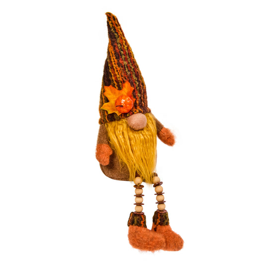 Decorative gnome figurine with a long hat and orange boots on a white background