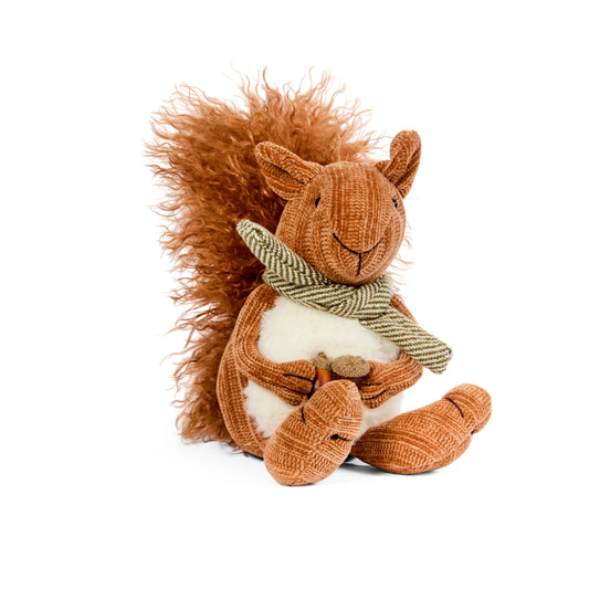 Stuffed squirrel toy with a scarf on a white background