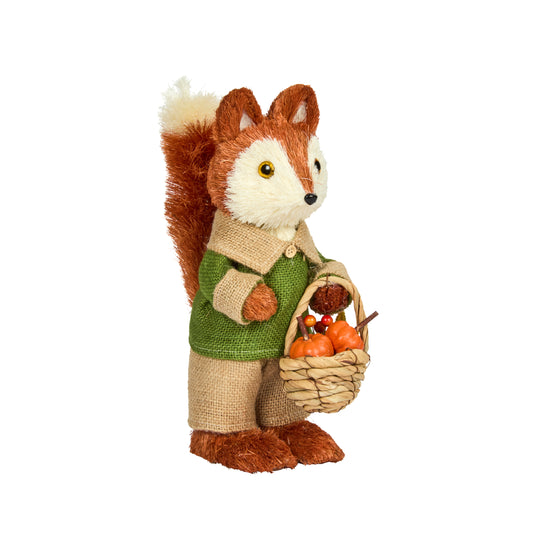 Stuffed fox toy wearing a green sweater holding a basket of pumpkins on a white background