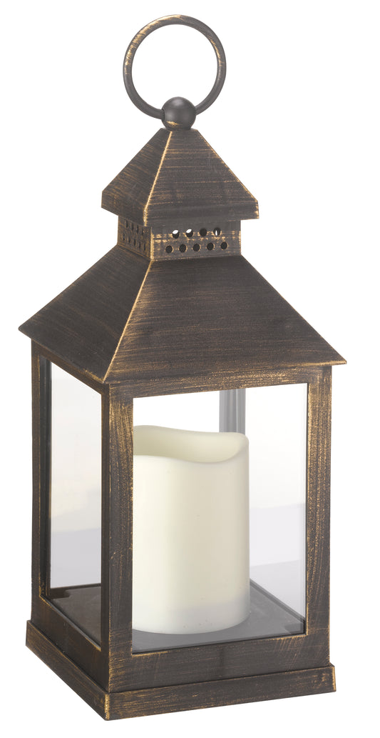 Decorative lantern with a white candle inside on a white background