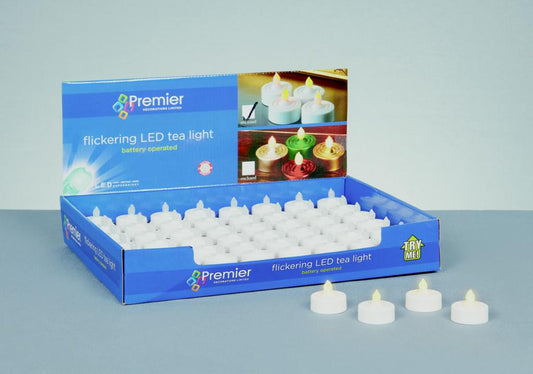 Box of Premier flickering LED tea light candles on a gray background