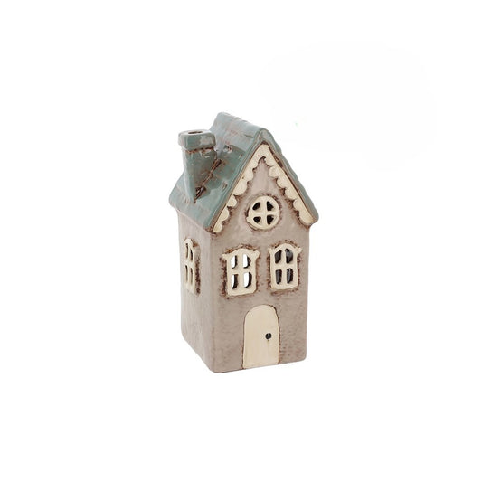 Small decorative house-shaped lantern on a white background
