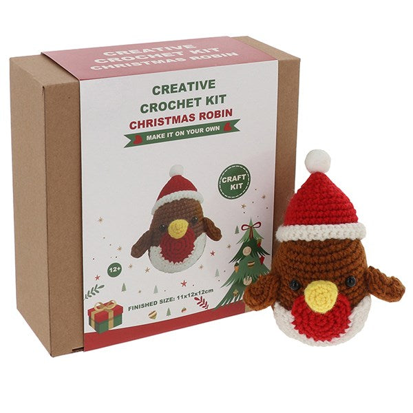 Crochet kit for making a Christmas robin with packaging on a white background