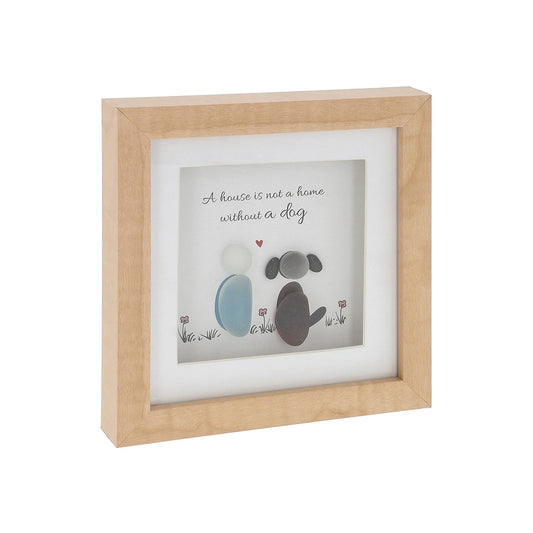 Framed artwork with paw prints and text 'A house is not a home without a dog' on a white background