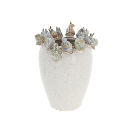 Decorative vase with shell designs on a white background