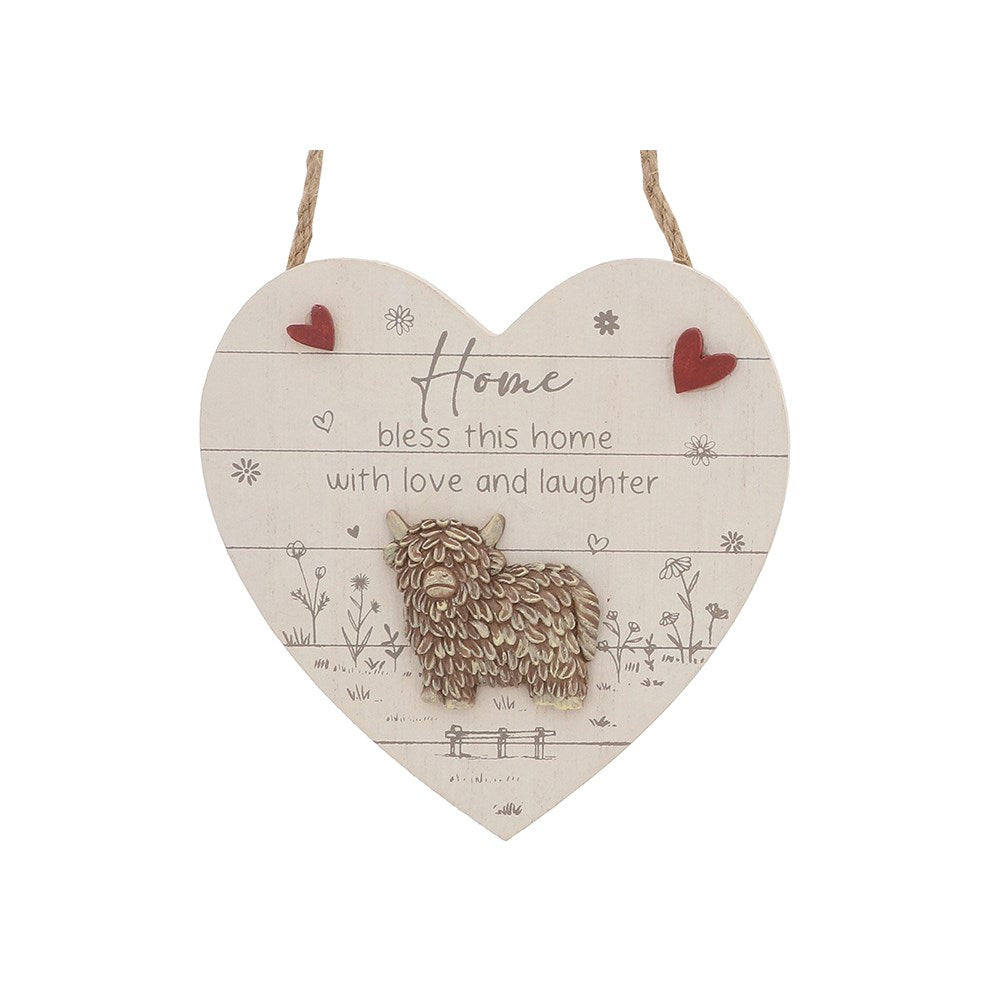 Decorative highland cow plaque on a white background