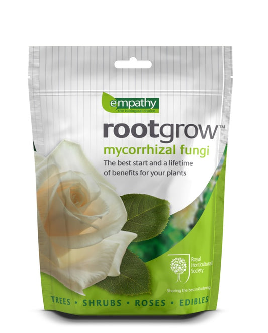 Rootgrow mycorrhizal fungi package with a white rose and green leaves on a white background