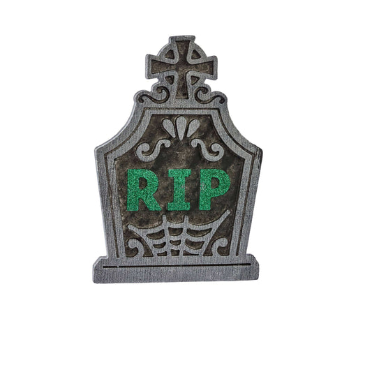 A Halloween tombstone decoration with a weathered gray stone texture, featuring 'RIP' in glittery green letters and a spiderweb design at the bottom, isolated on a white background.