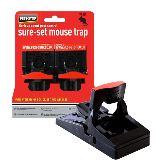 Black mouse trap with red and white packaging on a white background