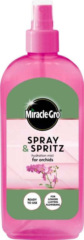 Pink spray bottle labeled 'Miracle-Gro Spray & Spritz' with a green label on a white background.