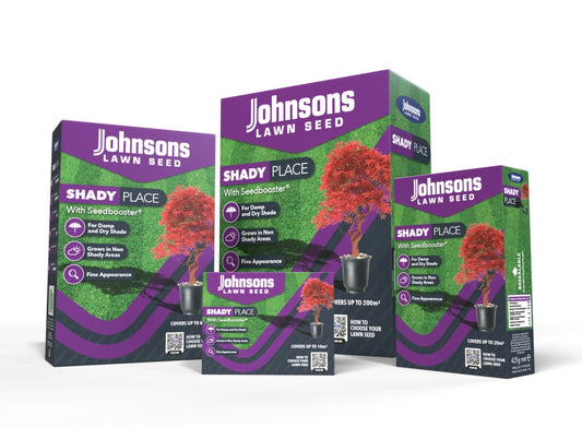 Three boxes of Johnsons Lawn Seed for shady places on a white background