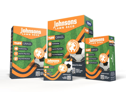 Three boxes of Johnsons Lawn Seed on a white background