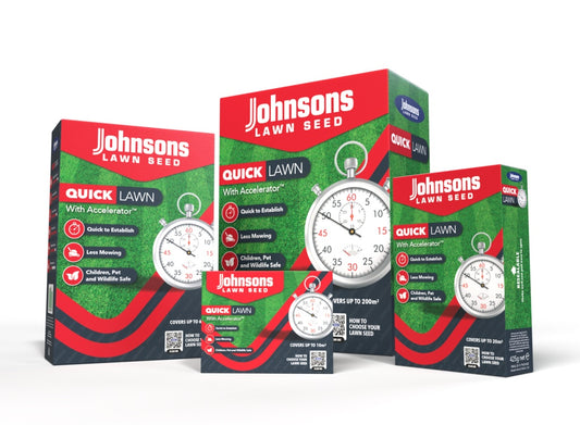 Three boxes of Johnsons Lawn Seed on a white background
