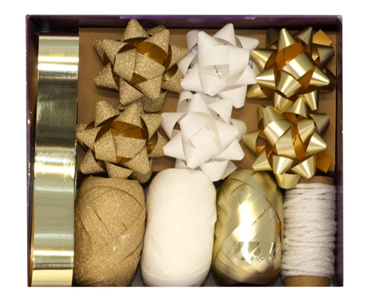 Decorative bows and ribbons in gold and white packaging