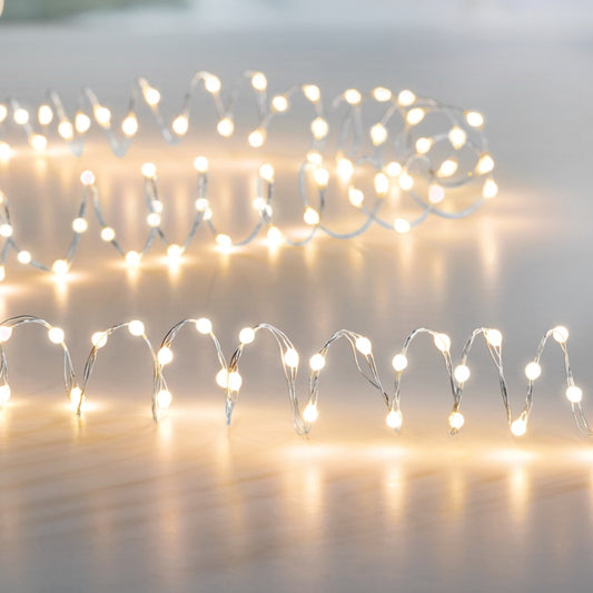 String of small lights on a white background