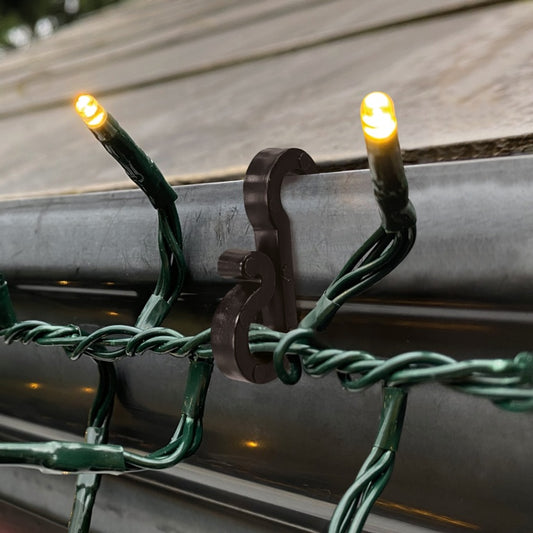 String lights with a metal bracket on a horizontal surface