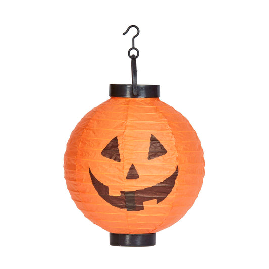 An orange paper lantern shaped like a jack-o'-lantern with a black hanging hook at the top, shown against a plain white background.