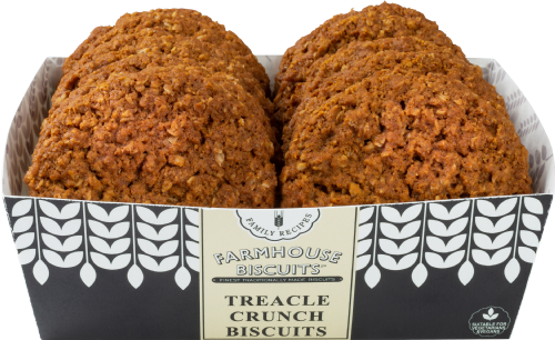 Two treacle crunch biscuits in a box with 'Farmhouse Biscuits' branding on a white background.