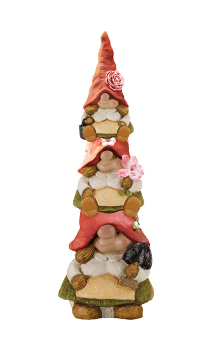 Stack of three decorative gnomes with colorful clothing on a white background