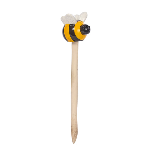 Bee-shaped object with a wooden handle on a white background