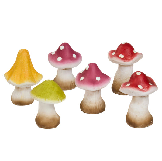 Set of colorful mushroom figurines on a white background