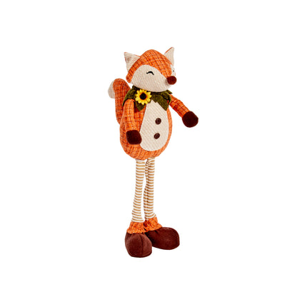 Stuffed fox toy with a bow tie on a white background