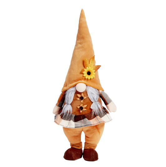 Decorative gnome with a brown hat and plaid skirt on a white background