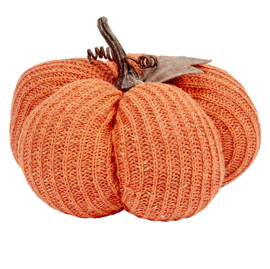 Knitted pumpkin decoration on a white background