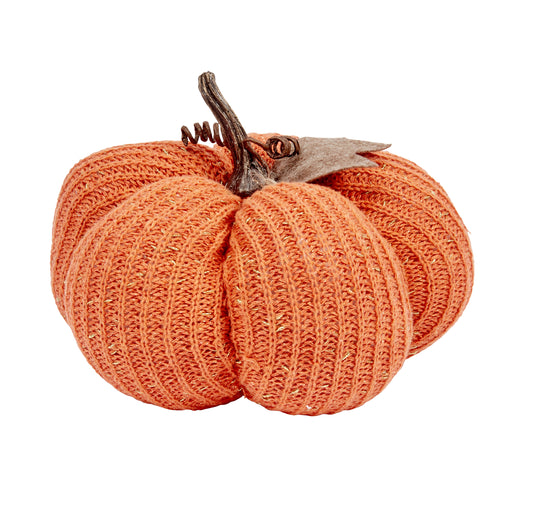 Knitted pumpkin decoration on a white background