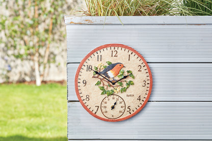 Decorative clock with a bird design on a wooden surface outdoors