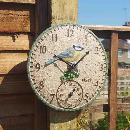 Decorative outdoor clock with bird design on a wooden post