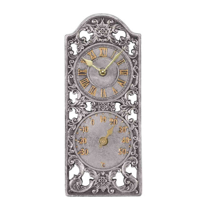 Decorative wall clock with intricate designs on a white background
