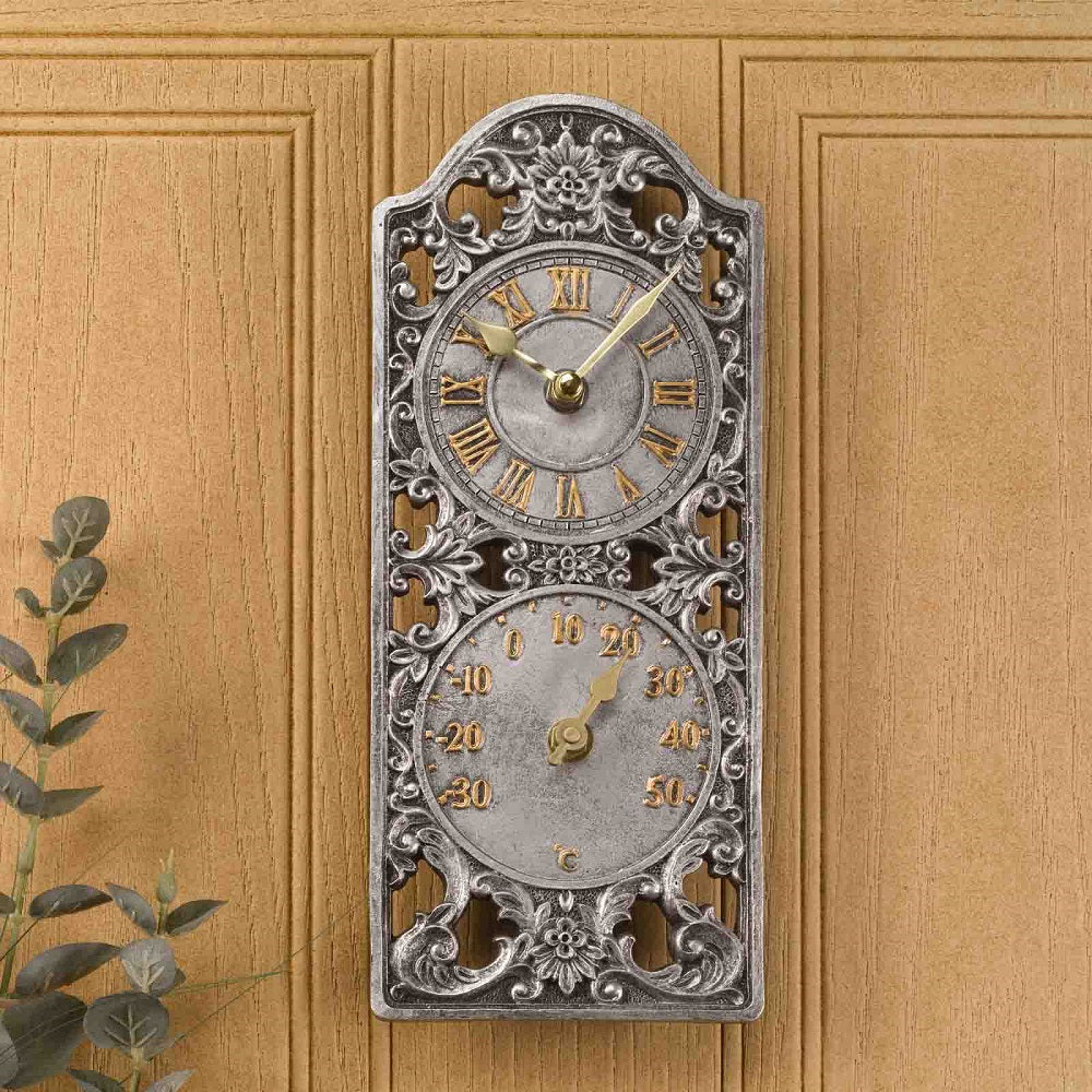 Decorative wall clock with Roman numeral design on a wooden background