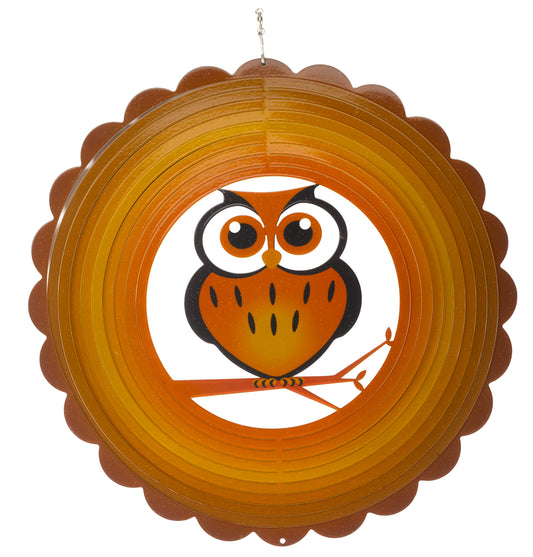 Decorative hanging disc with an owl design on a white background