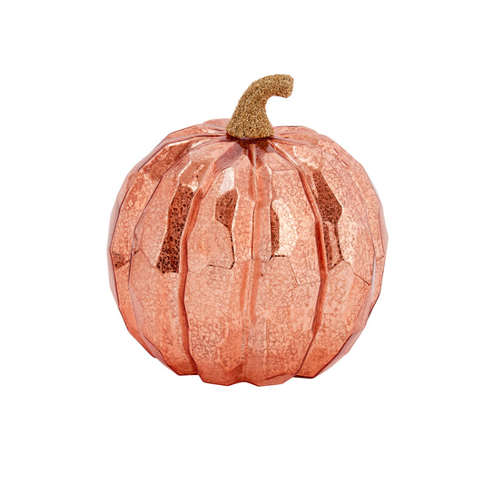 Decorative pumpkin with a rose gold finish on a white background
