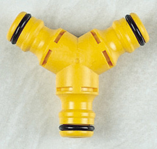 Yellow plastic Y-shaped fitting with black connectors on a white background