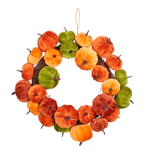 Decorative wreath with pumpkins in orange, green, and brown on a white background