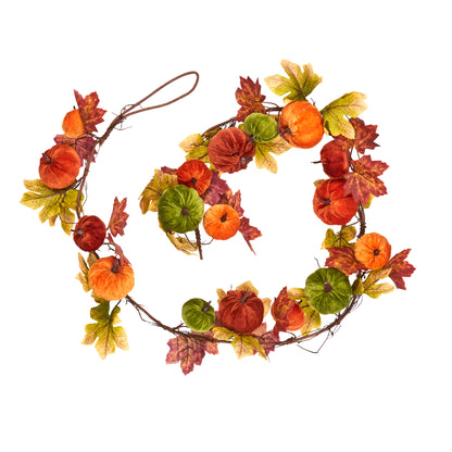 Decorative wreath with autumn leaves and pumpkins on a white background