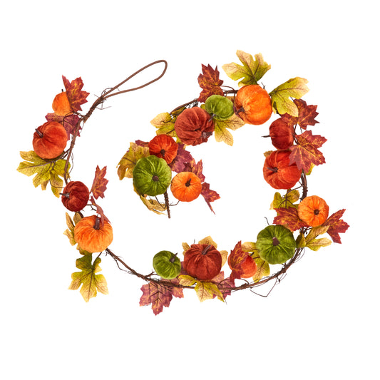 Decorative wreath with autumn leaves and pumpkins on a white background