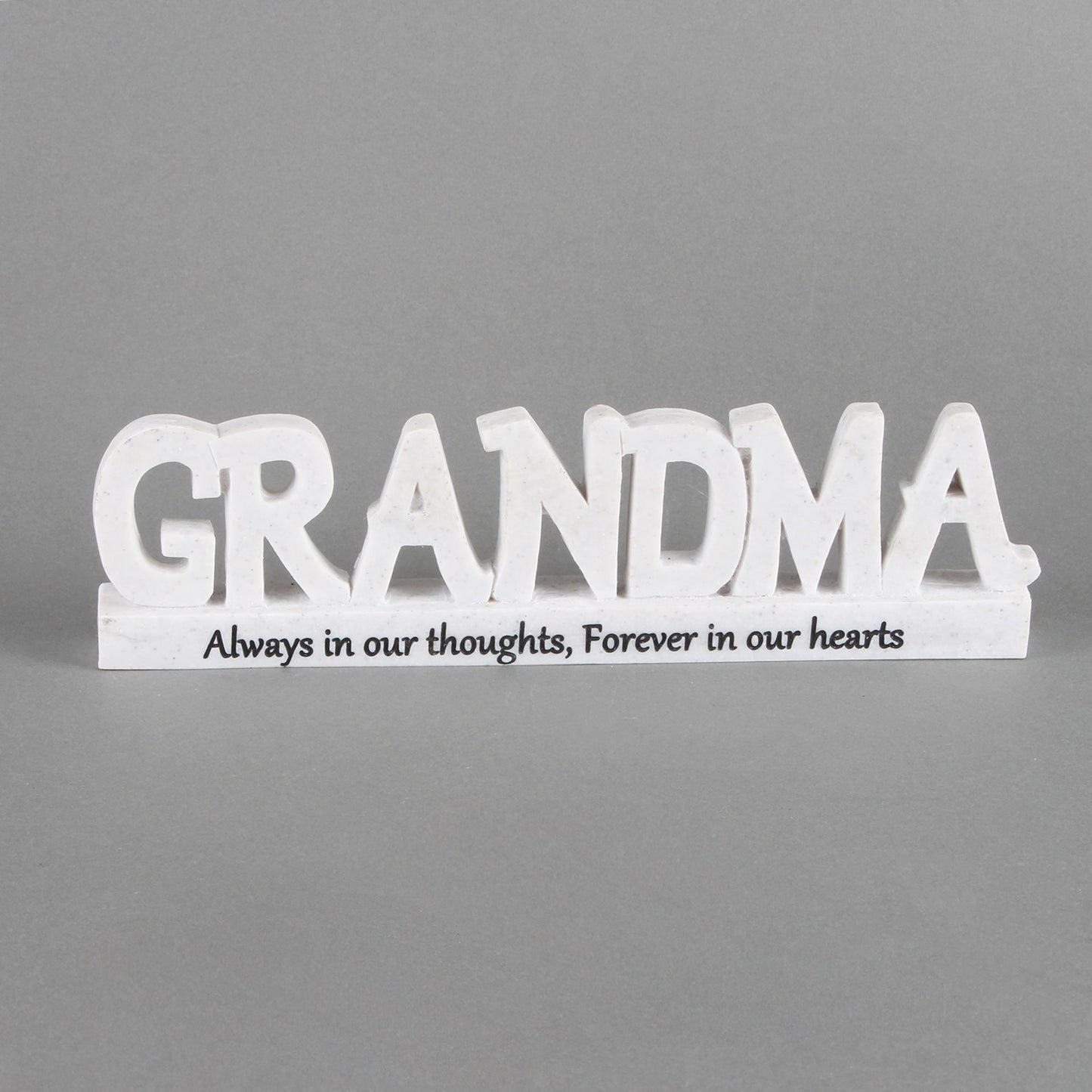 White wooden sign with 'GRANDMA' and text on a gray background