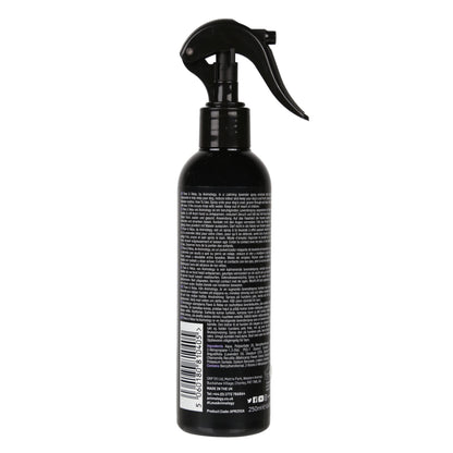 Black spray bottle with label on a white background