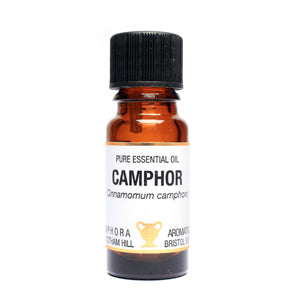 Bottle of pure essential oil labeled 'Camphor' on a white background