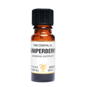 Bottle of pure essential oil labeled 'Unipiperberry' on a white background