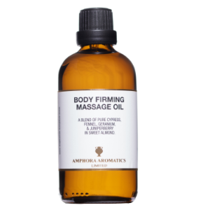 Bottle of body firming massage oil with a white label on a white background