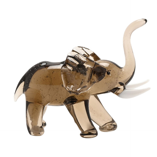 Glass elephant figurine on a white background