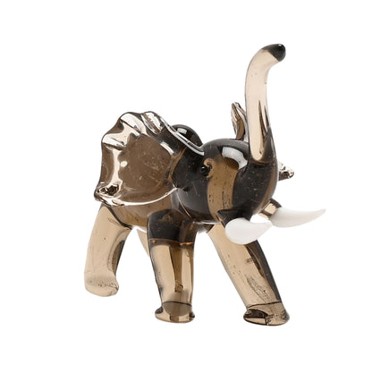 Glass elephant figurine on a white background